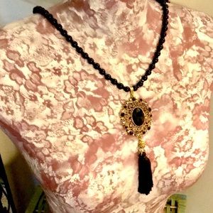 Black and Gold Beaded Necklace with Tassel Pendant. NWT!